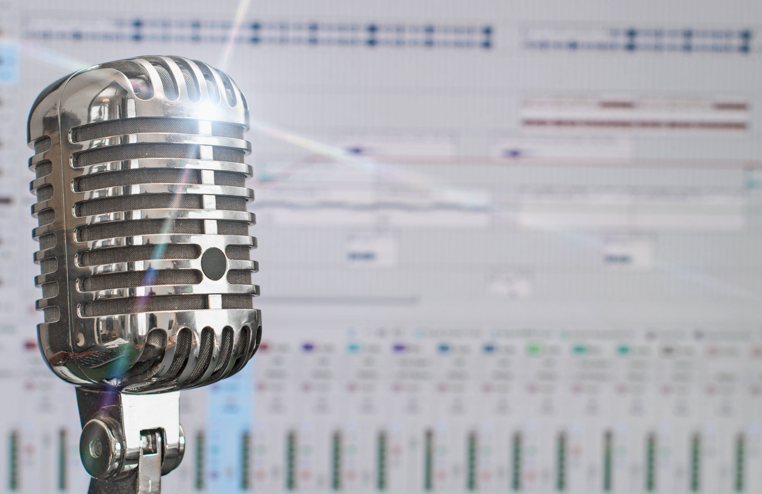 Retro microphone over recording software background.